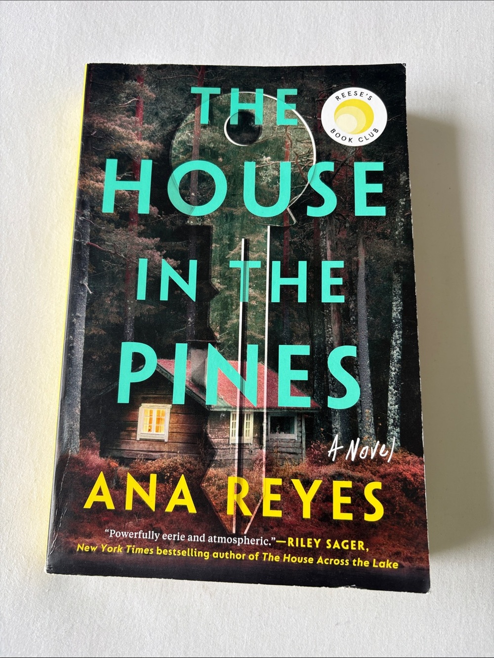 The House in the Pines by Ana Reyes - Teal & Yellow Cover